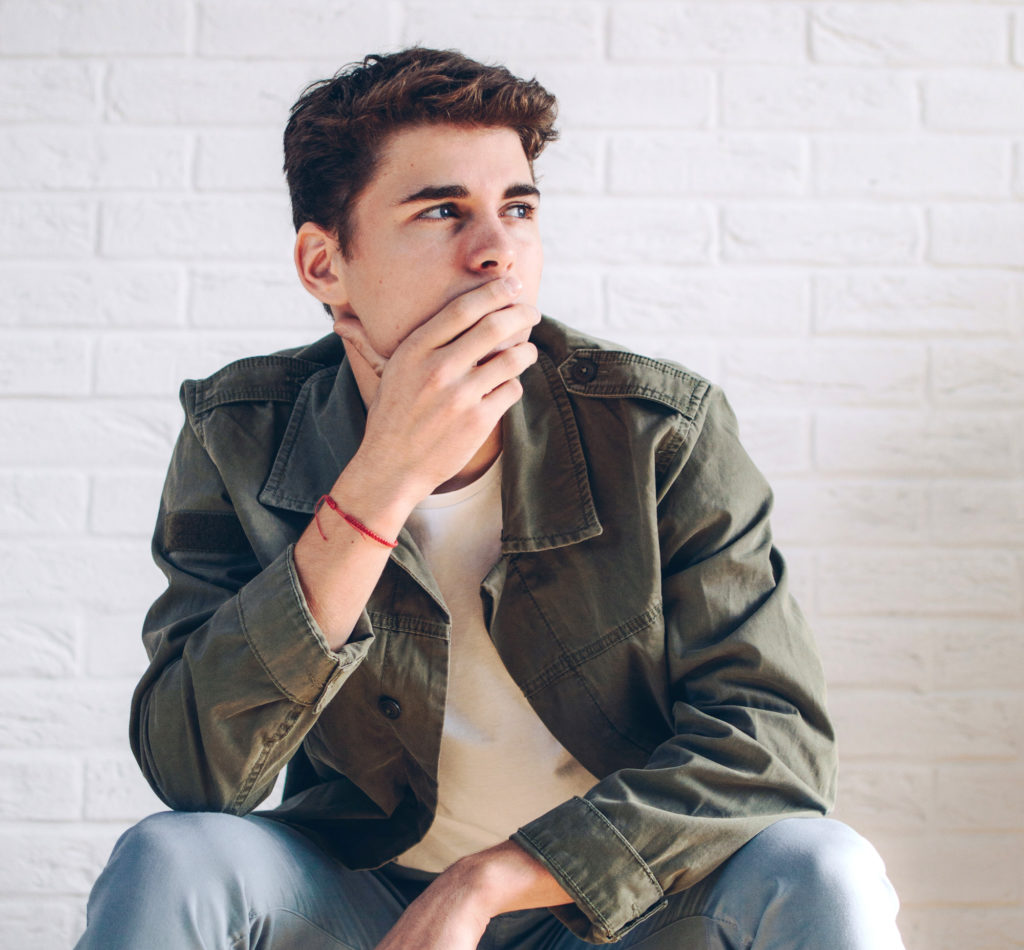 Pensive young man, thinking about how to last longer naturally