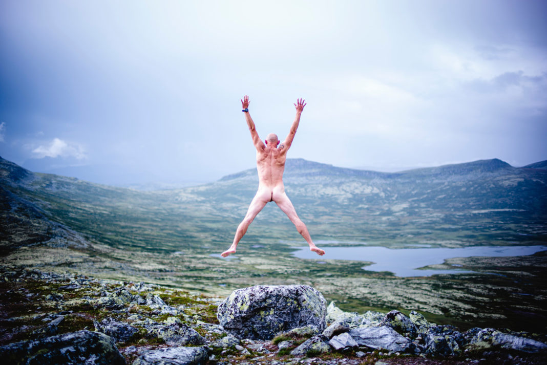 nude ecosexual man jumping