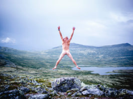 nude ecosexual man jumping