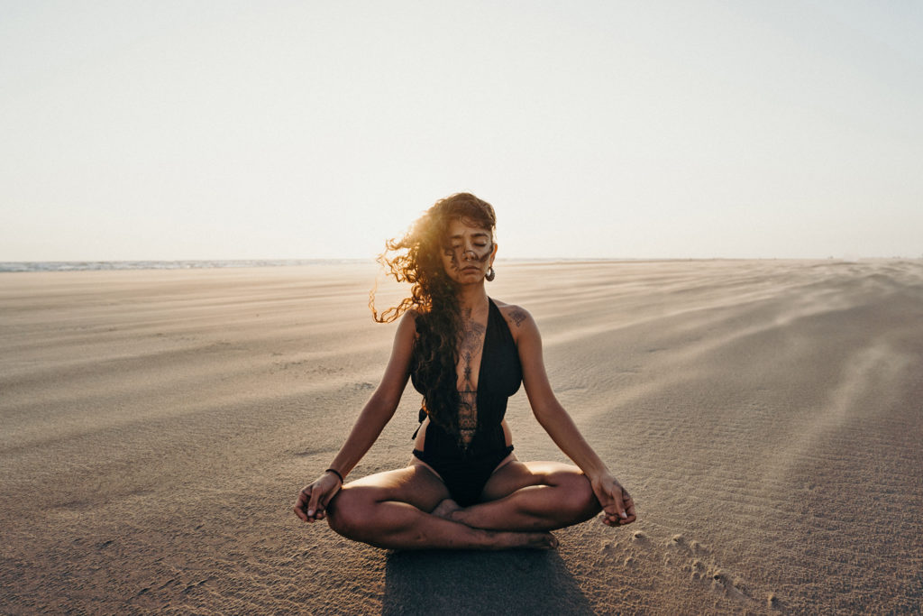 Woman doing sexual transmutation in desert