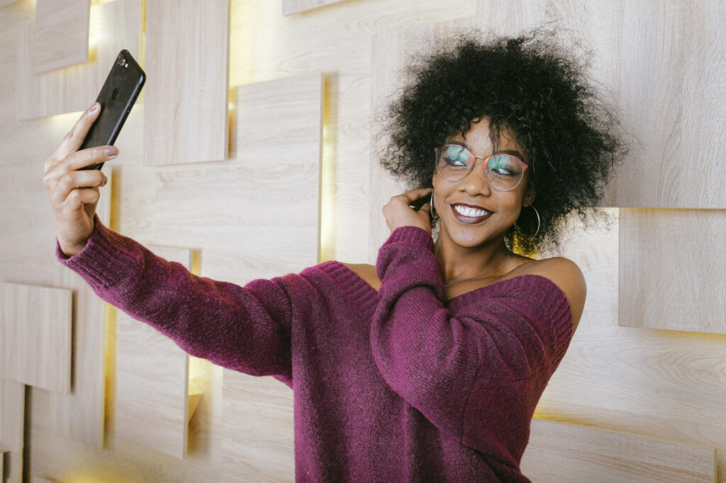Woman taking a selfie picture for an online dating profile