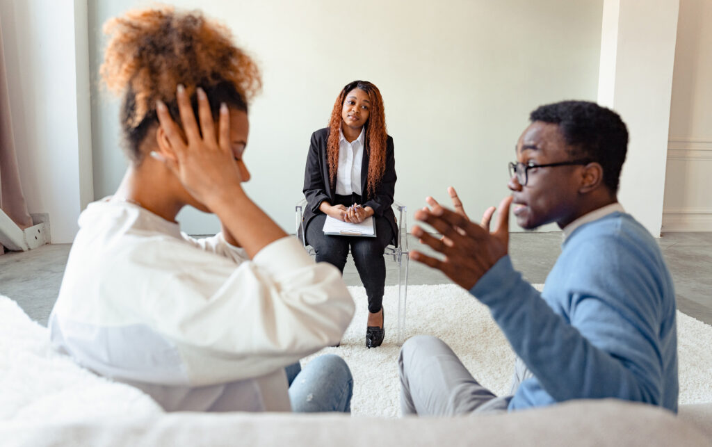 Relationship coach helping couple to resolve a relationship conflict