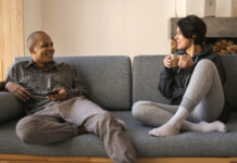 Couple on sofa, working on relationship repair