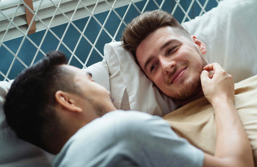 Two young gay men, contemplating a sexual experience