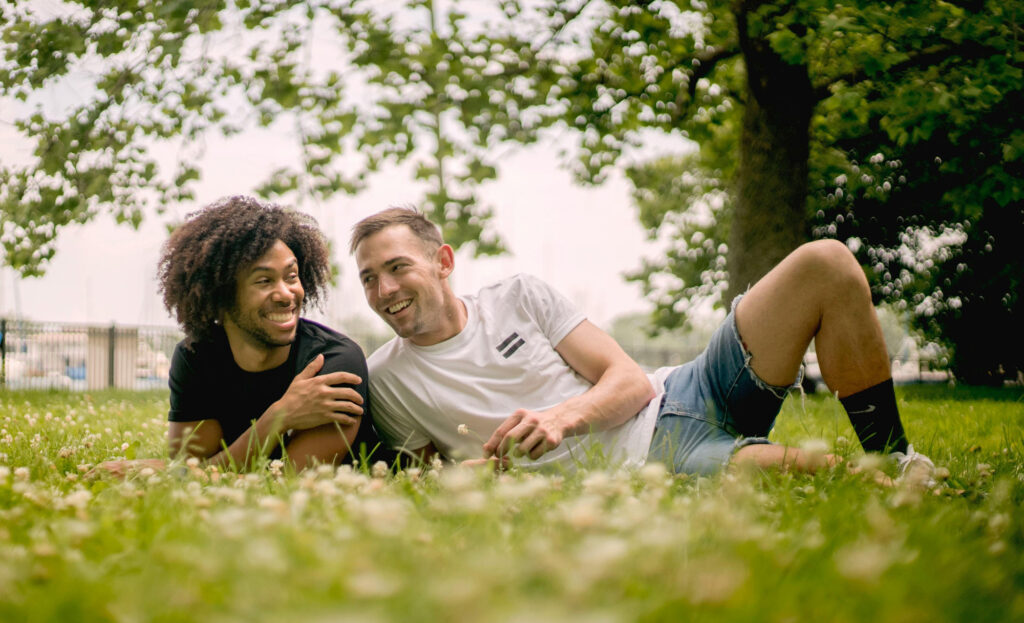 Gay couple discussing how to embrace acceptance in relationships