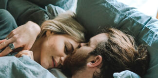 Couple in bed, dealing with grief and sex