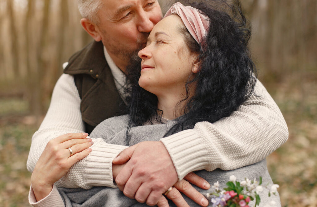 Older couple hugging, wondering if grief is an aphrodisiac